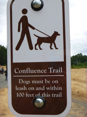 Signage at Confluence Trail: Dogs must be leashed within 100 feet of trail